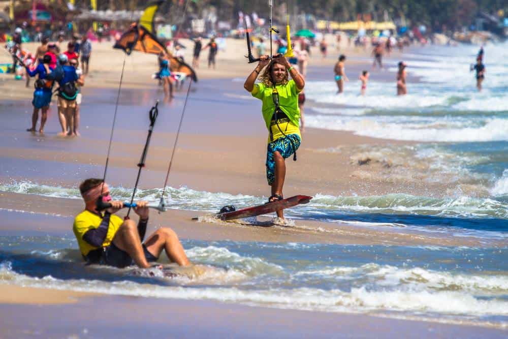 2 kitesurfers preparing to go out on the water in Mui Ne