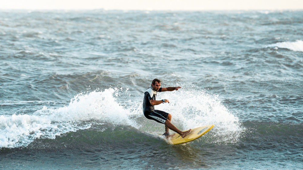 Surfing at Mui Ne Beach, Vietnam