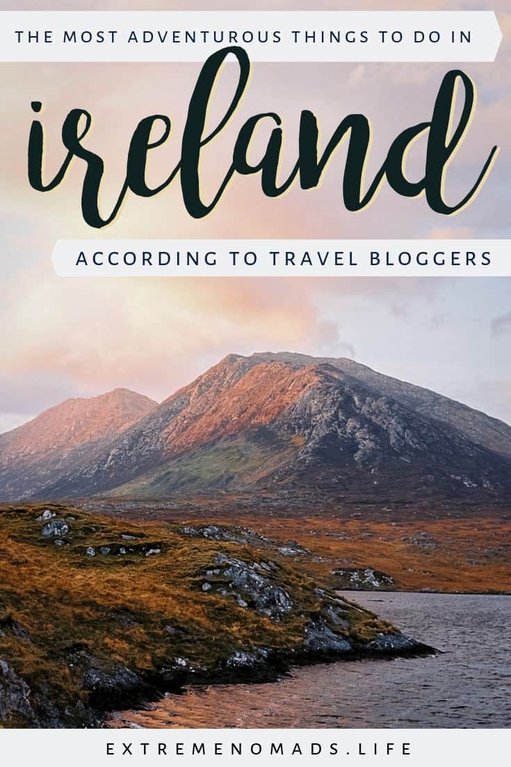 pinterest image with a picture of a pink sky over the connemara mountains and a caption that reads: the most adventurous things to do in ireland according to travel bloggers