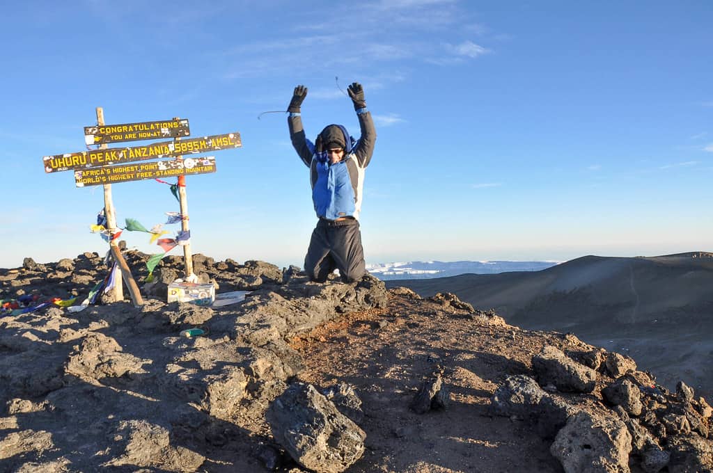 one of the authors jumping up with his arms in the air while hiking Kilimanjaro in Africa. http://creativecommons.org/licenses/by/2.0/