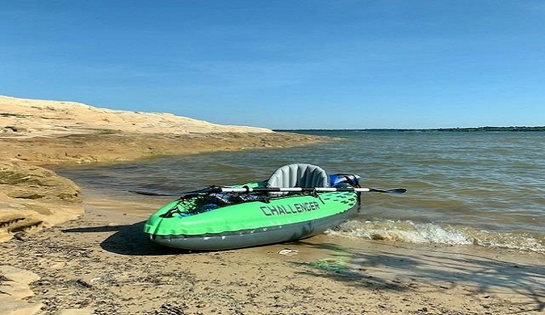 youth sit in kayak